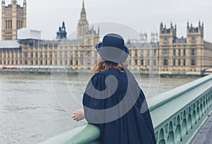 Woman with bowler hat at hopuses of parliament