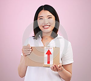 Woman, box and delivery, courier and e commerce with portrait and package isolated on pink background. Asian customer