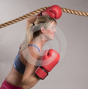 Woman boxer with red boxing gloves