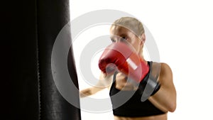 Woman boxer takes out aggression on the punching bag