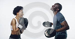 Woman, boxing and black man in studio for fitness, class and punching for martial arts by white background. Boxer girl