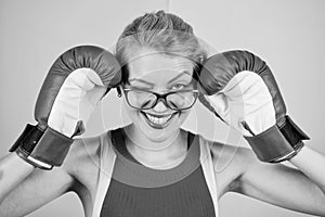 Woman boxing gloves adjust eyeglasses. Win with strength or intellect. Strong intellect victory pledge. Know how defend