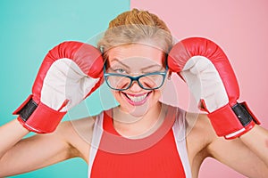 Woman boxing gloves adjust eyeglasses. Win with strength or intellect. Strong intellect victory pledge. Know how defend