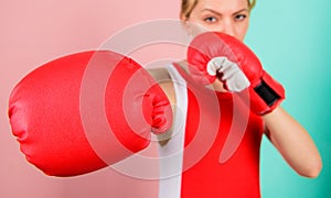 Woman boxing gloves focused on attack. Ambitious girl fight boxing gloves. Female rights. I am gonna kick you off