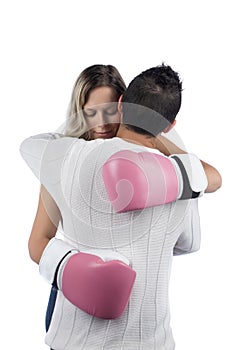 Woman with boxing gloves hugging husband