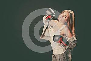 Woman with boxing gloves wear sportswear.