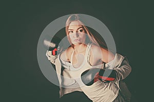 Woman with boxing gloves wear sportswear.