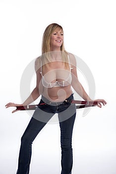 Woman in bra holding braces