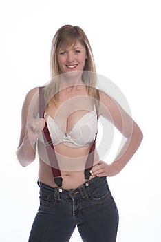 Woman in bra holding braces suspenders