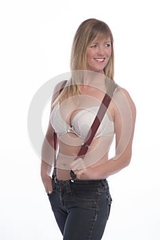 Woman in bra holding braces suspenders