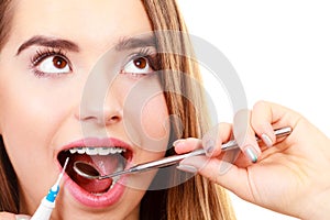 Woman with braces having dentist appointment