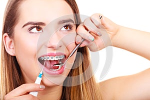 Woman with braces having dentist appointment