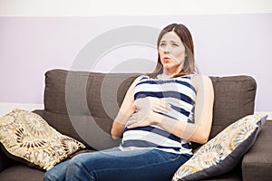 Woman with braxton hicks contractions photo