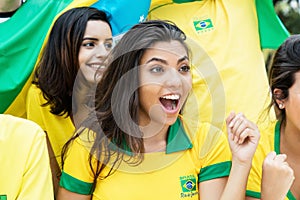 Woman from Brazil with other brazilian soccer fans at stadium