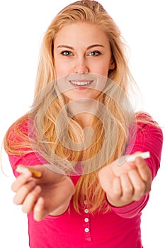 Woman breaking cigarette as a gesture of quitting smoking, break