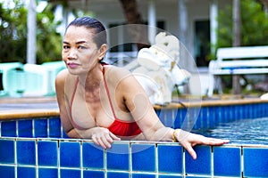 Woman breast sex symbol portrait with red bikini