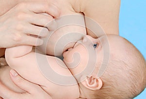 Woman breastfeeding her little baby