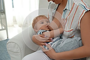 Woman breastfeeding her little baby