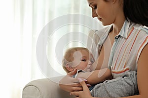 Woman breastfeeding her little baby