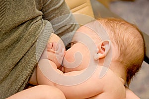 Woman breastfeeding her small baby