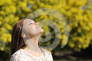 Woman breathing deep in spring or summer