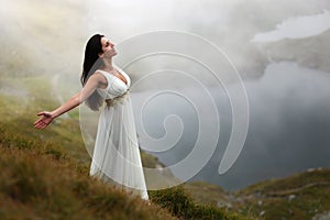 Woman breathing fresh mountain air