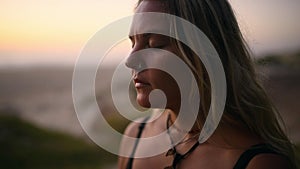 Woman, breathing and meditation on beach at sunrise for mindfulness practice, spiritual morning or holistic zen. Female