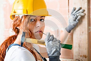 Woman Bricklayer with Hammer