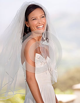 Woman, bridal fashion and smile on wedding day in outdoors, veil and laughing in nature. Female person, makeup and happy