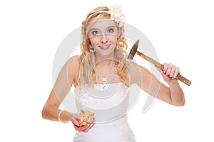 Woman bride with hammer about to smash piggy bank