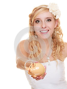 Woman bride with piggy bank