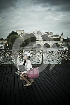 Woman in the bridge of arts in paris