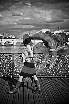 Woman in the bridge of arts in paris