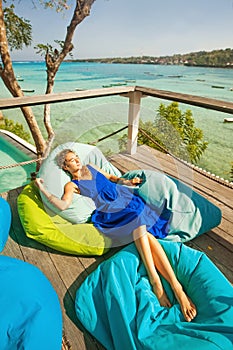 Woman on a bright beanbag chair