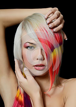 Girl with a bright make-up and multi-coloured hair photo