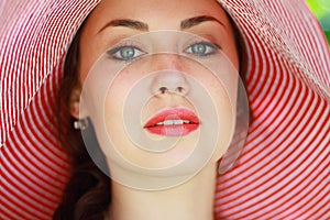 Woman in bright summer hat