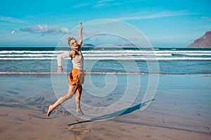 Woman with broken arm on beach. Arm cast, injured during family vacation in holiday resort. Concept of beach summer