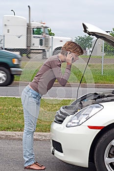 Woman with broken down car