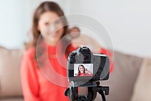 Woman with bronzer and camera recording video photo