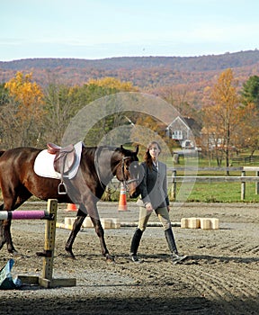 Woman with Brown Horse in Fall