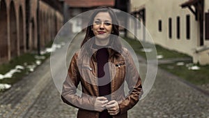 Woman in brown leather jacket