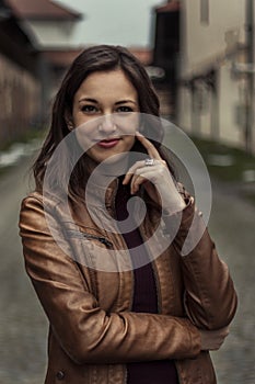 Woman in brown leather jacket