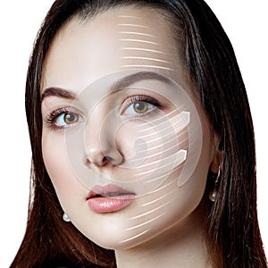 Woman brunette graphic lines shows facial lifting effect.