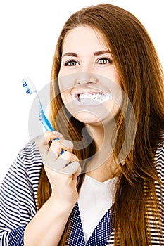 Woman brushing cleaning teeth.