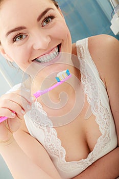 Woman brushing cleaning teeth. Oral hygiene.