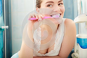 Woman brushing cleaning teeth. Oral hygiene.
