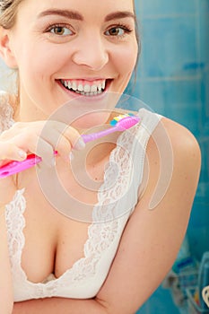 Woman brushing cleaning teeth. Oral hygiene.