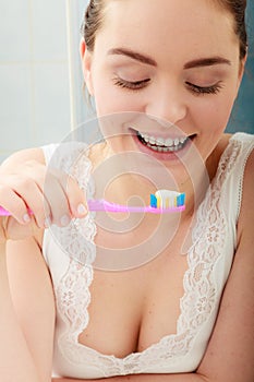 Woman brushing cleaning teeth. Oral hygiene.