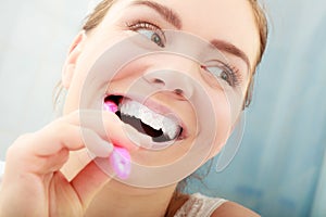 Woman brushing cleaning teeth. Oral hygiene.