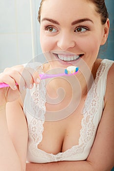 Woman brushing cleaning teeth. Oral hygiene.